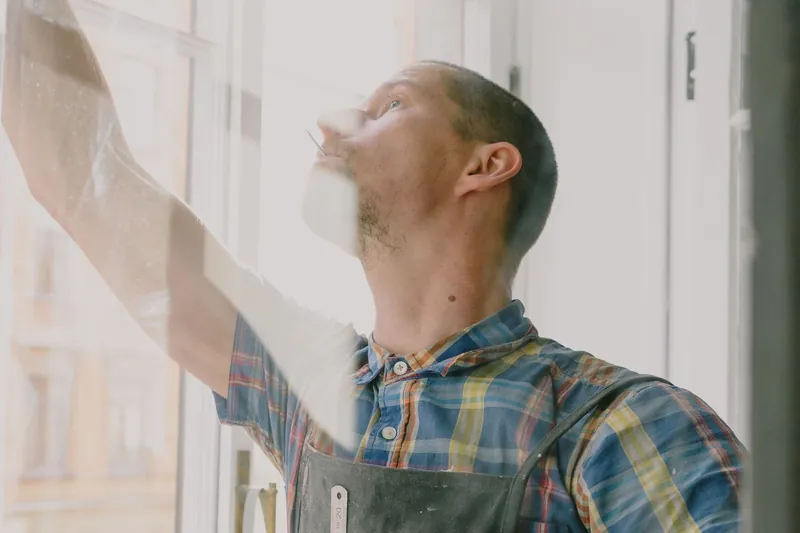 Installer checking a newly fitted window