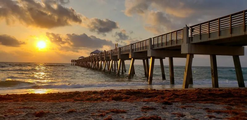 Juno Beach Pier at sunrise over the Atlantic