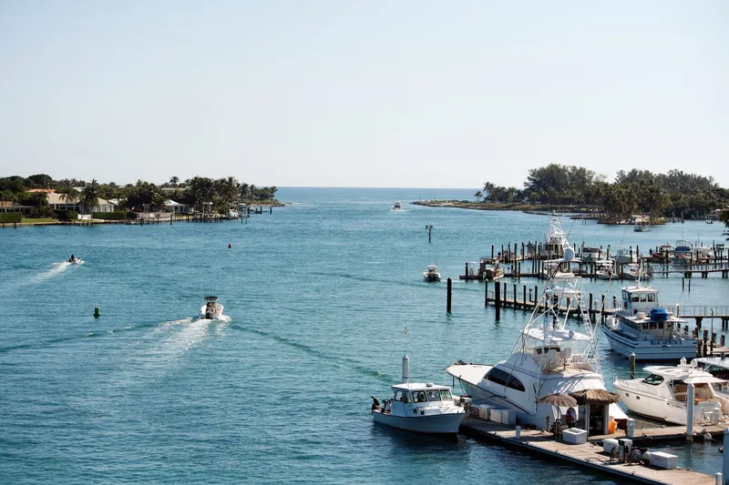 Boats and docks near the Jupiter Inlet on a clear day
